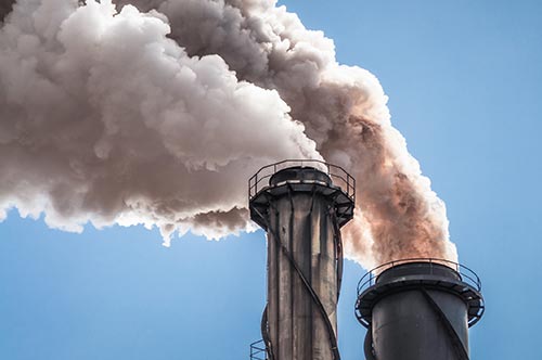 Mechanic checks car undercarriage in GMG-compliant noise-controlled workshop