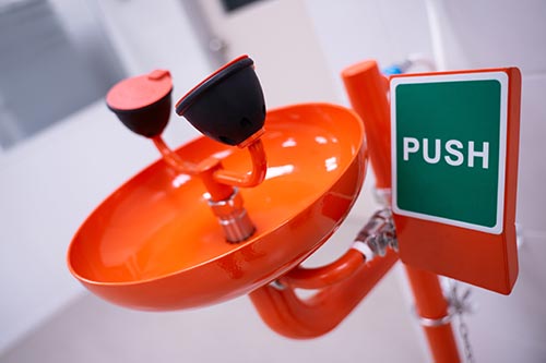 Technician in a mask smiles, breathing easy with GMG’s air quality standards