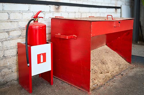 Technician in a mask smiles, breathing easy with GMG’s air quality standards