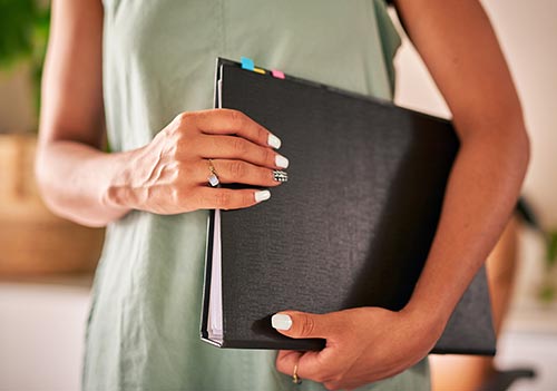 Technician in a mask smiles, breathing easy with GMG’s air quality standards