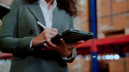 Technician in a mask smiles, breathing easy with GMG’s air quality standards