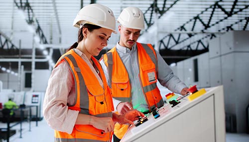 Mechanic responsibly refilling fluids, mindful of GMG's hazardous material protocols