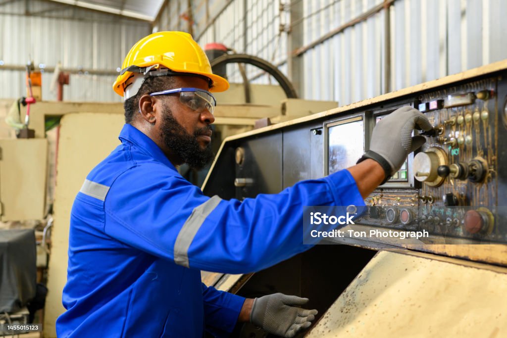 EHS-trained welder practicing fire prevention in a collision repair shop