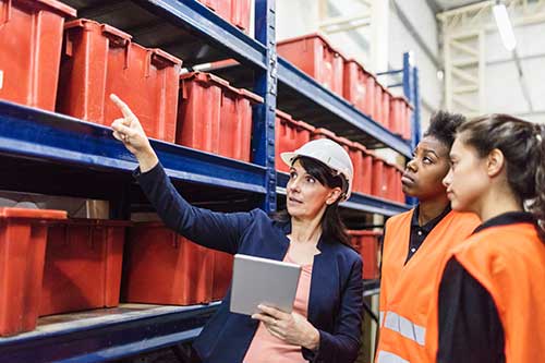 Technician in a mask smiles, breathing easy with GMG’s air quality standards