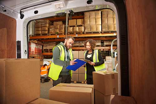 Technician in a mask smiles, breathing easy with GMG’s air quality standards