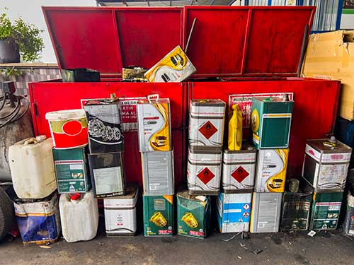 Technician in a mask smiles, breathing easy with GMG’s air quality standards