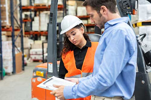 Technician in a mask smiles, breathing easy with GMG’s air quality standards