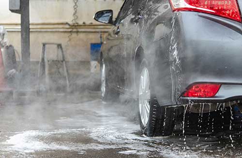 EHS-trained welder practicing fire prevention in a collision repair shop