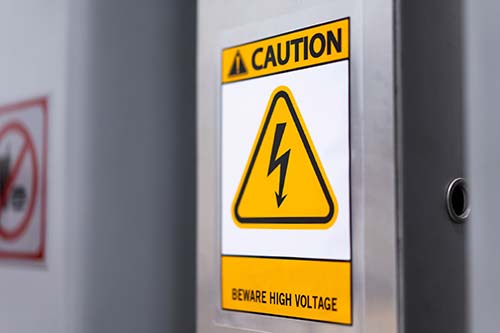 Technician in a mask smiles, breathing easy with GMG’s air quality standards