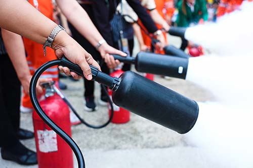 Technician in a mask smiles, breathing easy with GMG’s air quality standards
