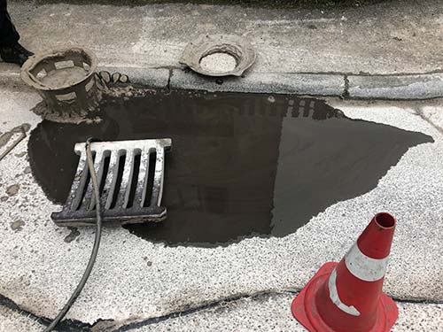 Technician in a mask smiles, breathing easy with GMG’s air quality standards