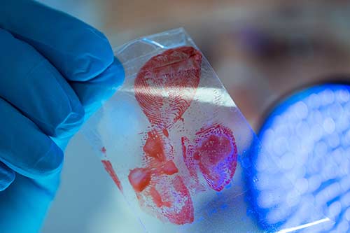 Technician in a mask smiles, breathing easy with GMG’s air quality standards