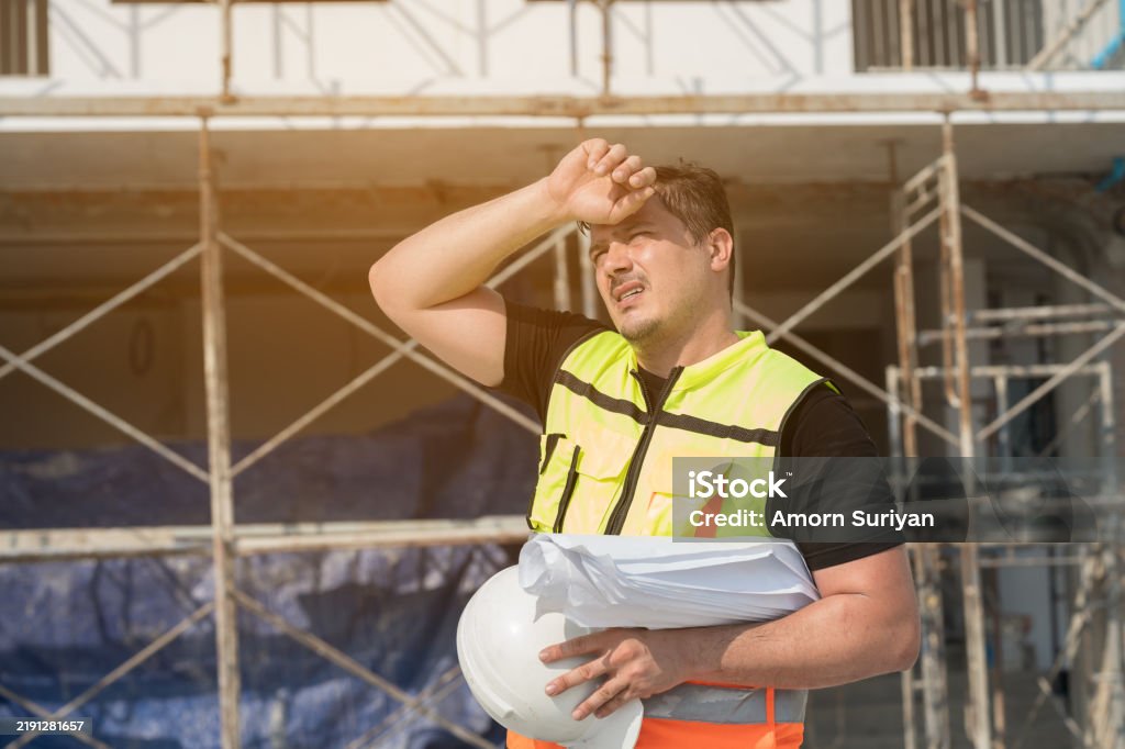 Mechanic responsibly refilling fluids, mindful of GMG's hazardous material protocols