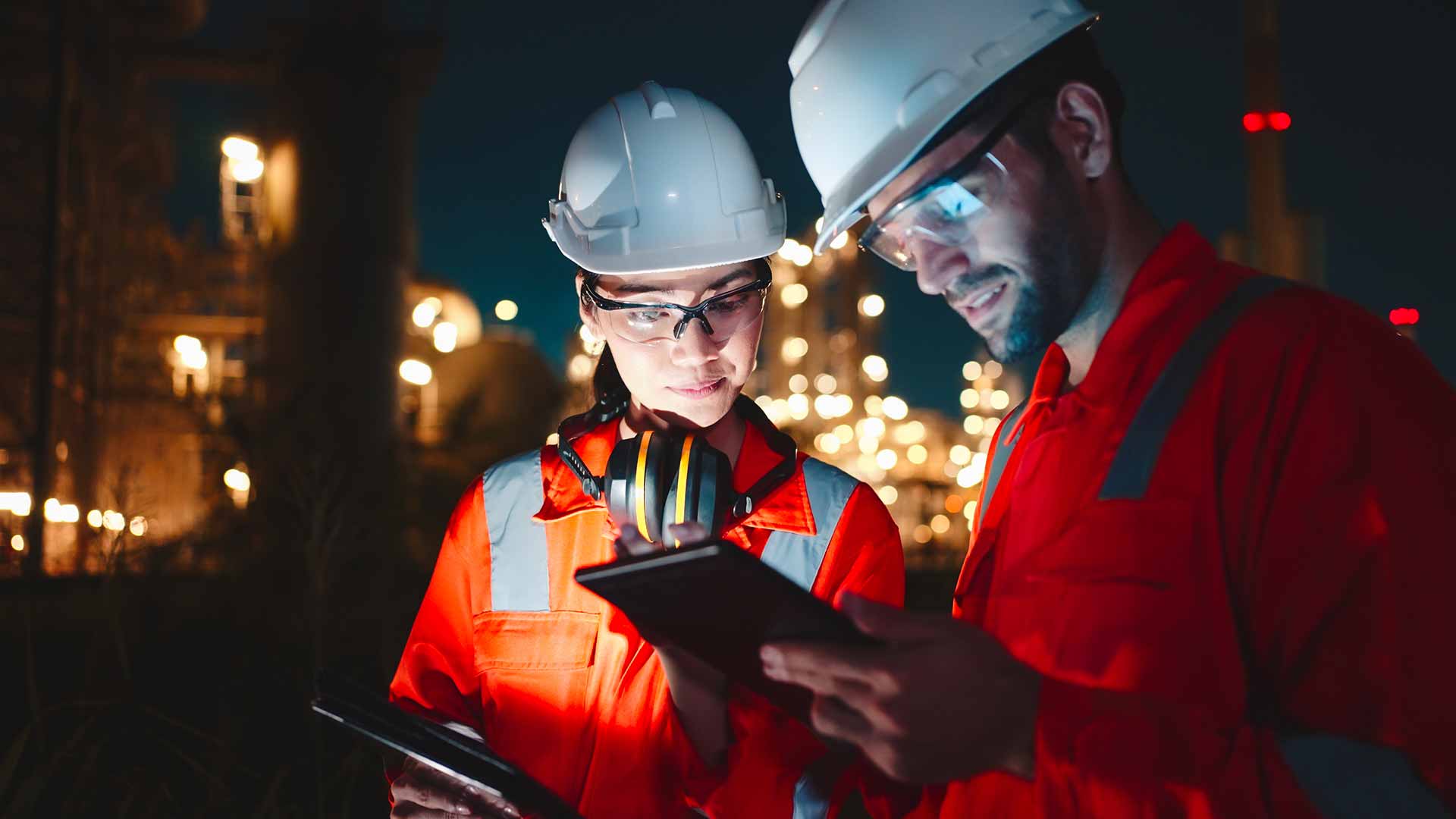 Technician spray painting car with GMG's EHS-compliant collision repair solutions