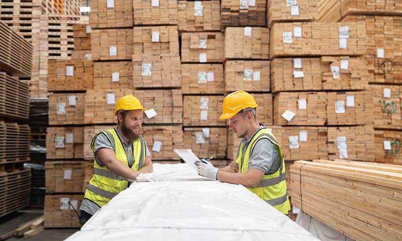 EHS-trained welder practicing fire prevention in a collision repair shop