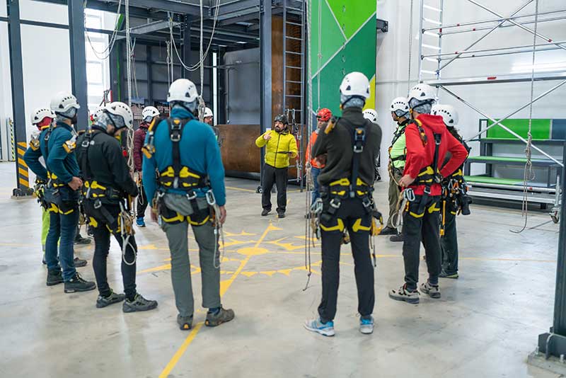 Technician in a mask smiles, breathing easy with GMG’s air quality standards