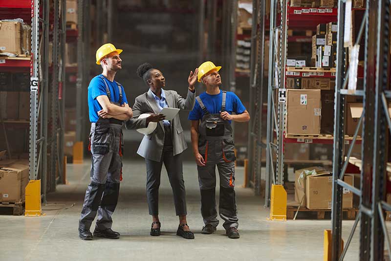 Technician in a mask smiles, breathing easy with GMG’s air quality standards