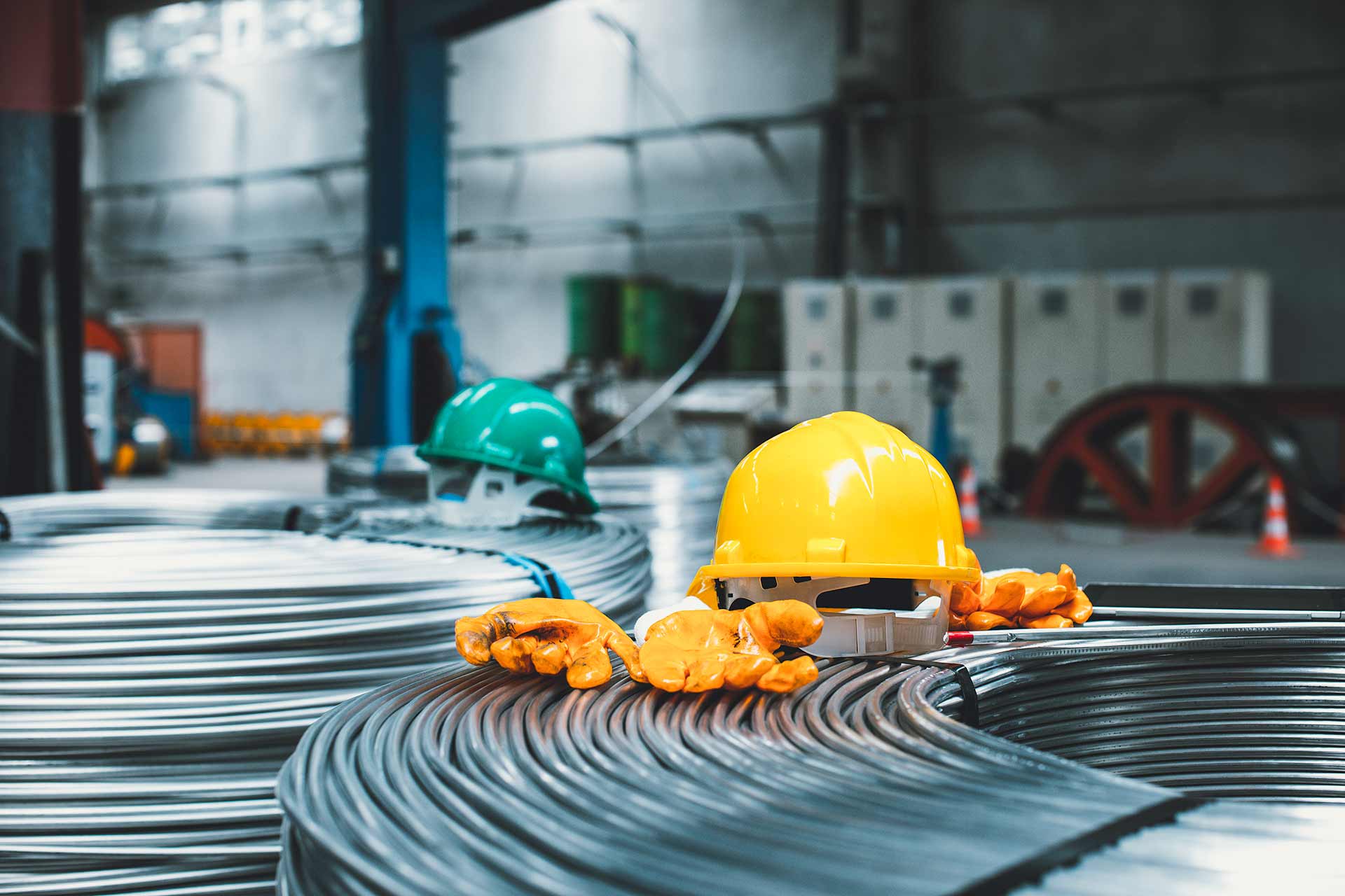 Technician spray painting car with GMG's EHS-compliant collision repair solutions