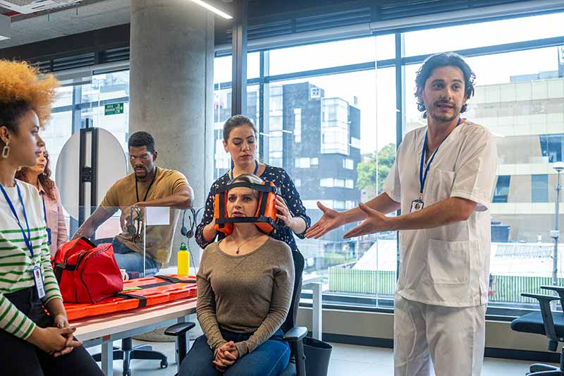 EHS-trained welder practicing fire prevention in a collision repair shop