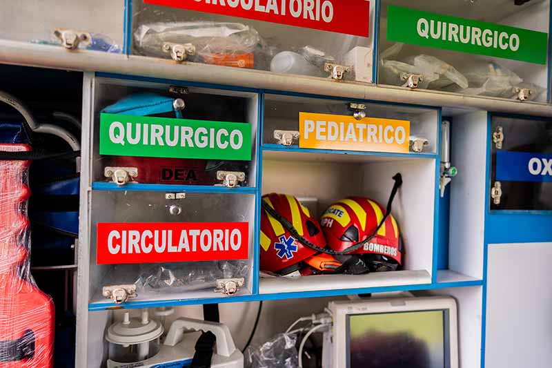 Mechanic responsibly refilling fluids, mindful of GMG's hazardous material protocols