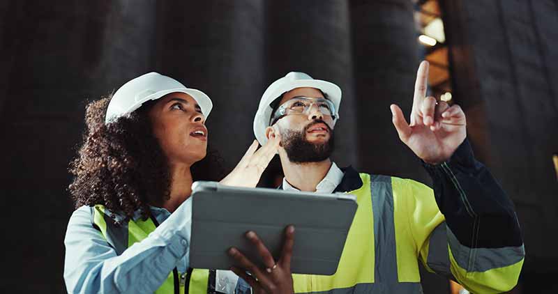 Mechanic responsibly refilling fluids, mindful of GMG's hazardous material protocols