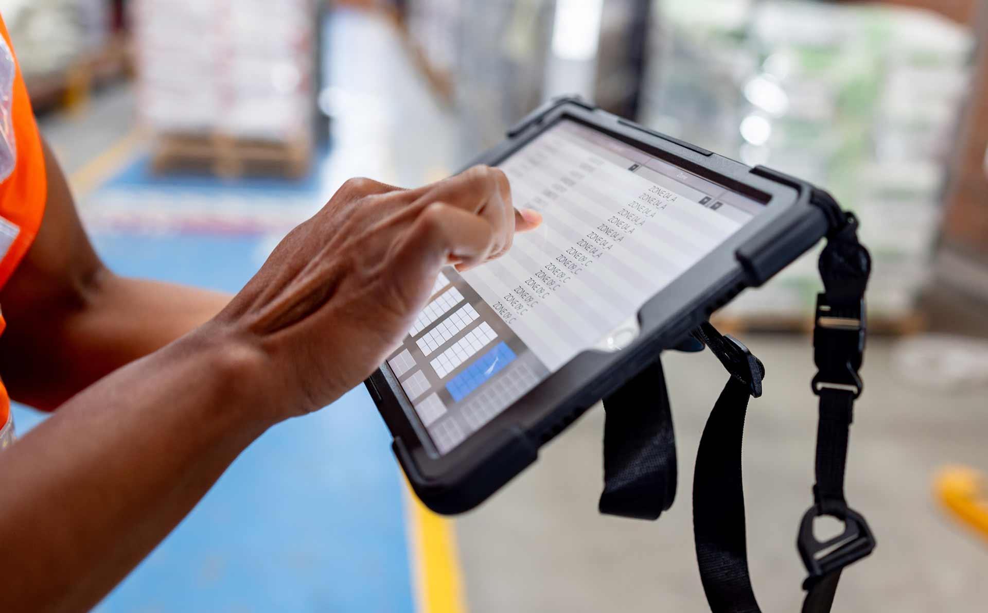 Technician spray painting car with GMG's EHS-compliant collision repair solutions