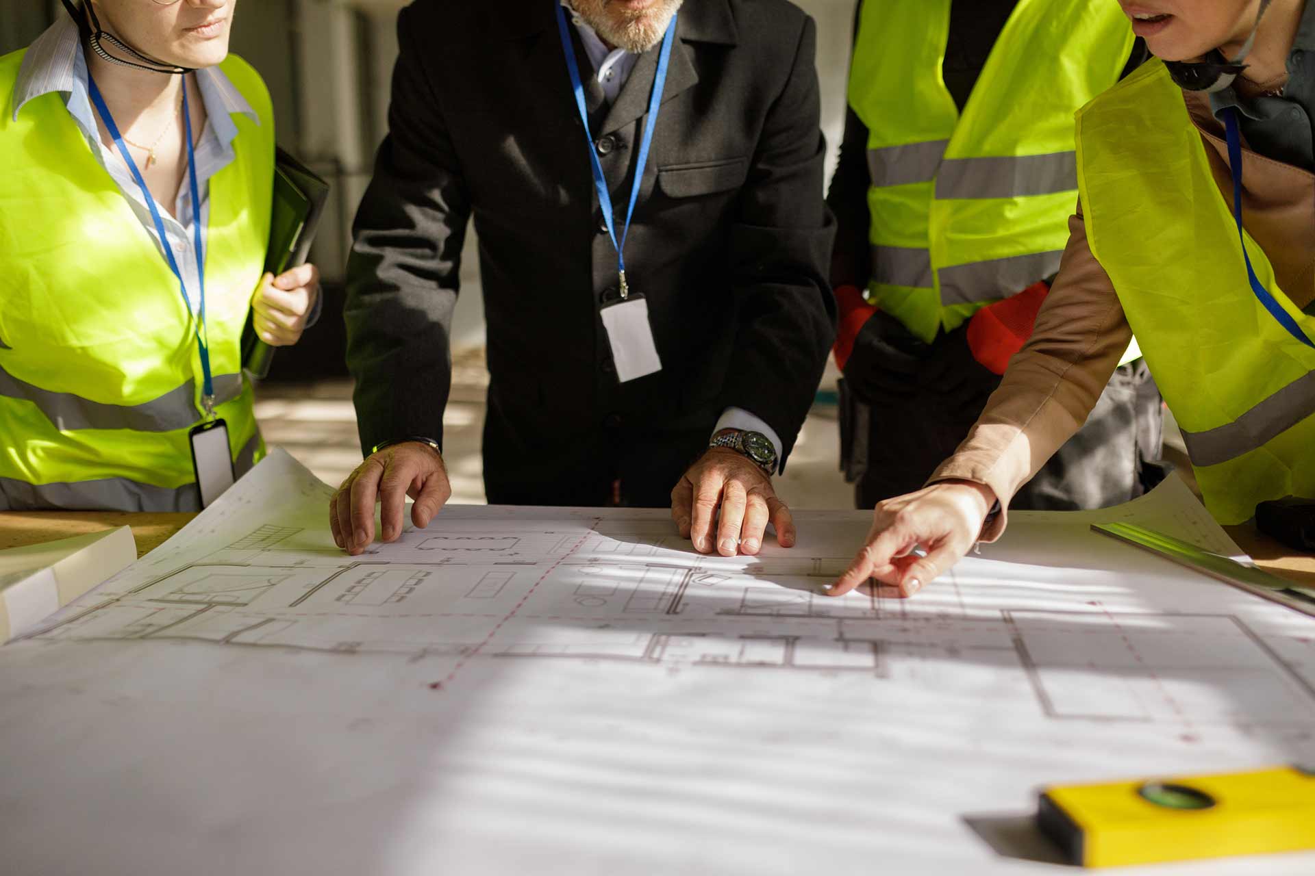 Technician spray painting car with GMG's EHS-compliant collision repair solutions