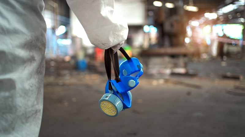 Mechanic checks car undercarriage in GMG-compliant noise-controlled workshop