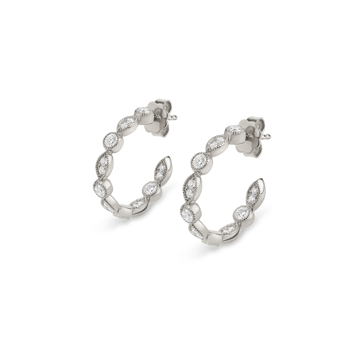 No other stone is as wondrous as the diamond. No other stone is as coveted. A stone that captures the most beautiful memories. With our handmade Les Diamants collection, crafted with loving details, you’ll write your own story and eternalize the magical moments. These handmade hoop earrings in white gold feature grain-set brilliant-cut diamonds.