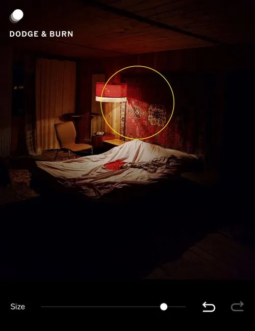 Dodge and Burn exposure brush in VSCO being used to brighten specific area of a dark room