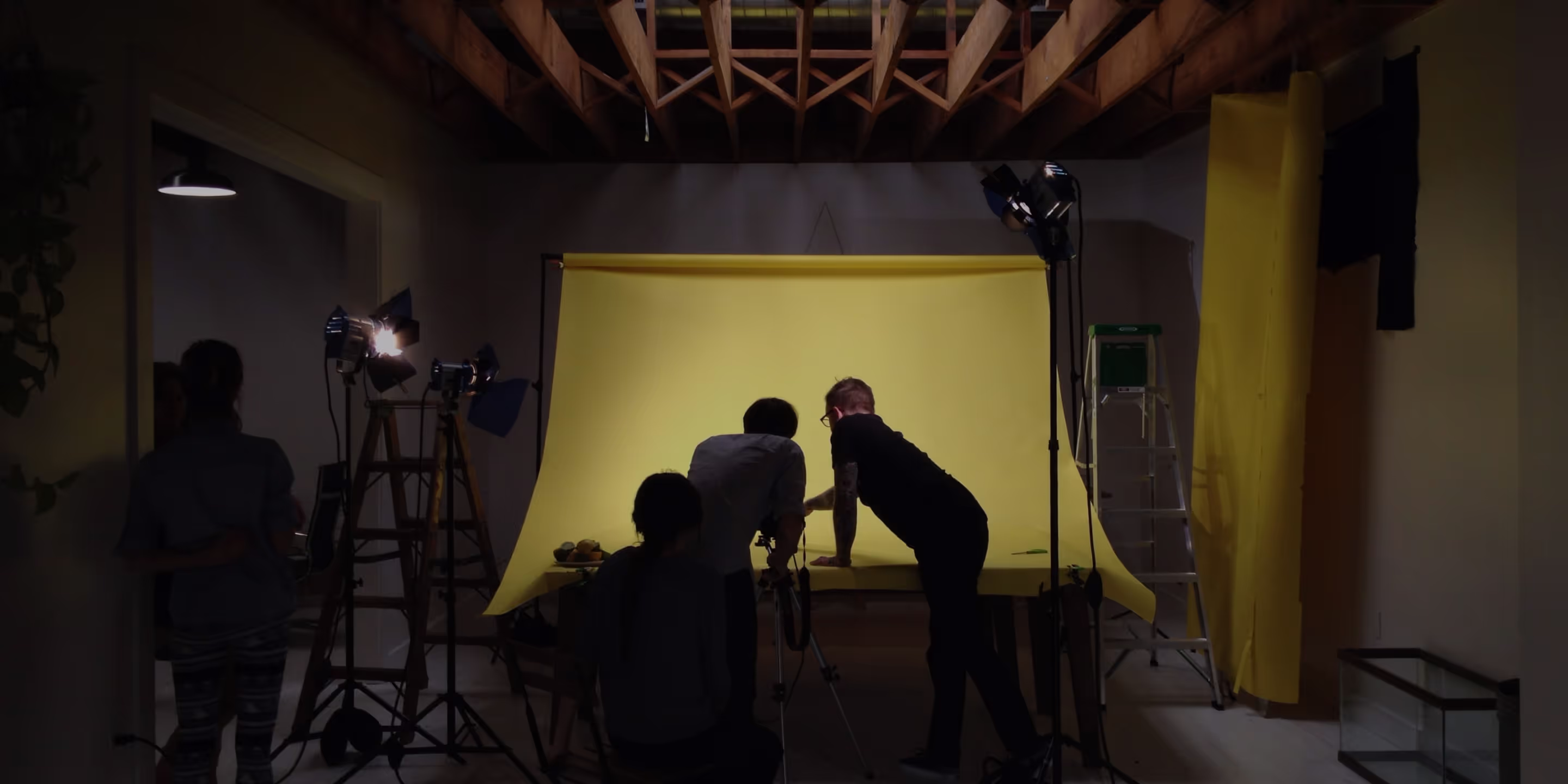 Photographers setting up a photoshoot for a photography challenge