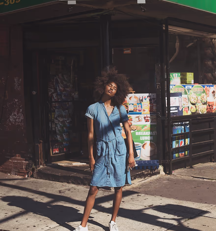 Faded image of a woman in front of a store