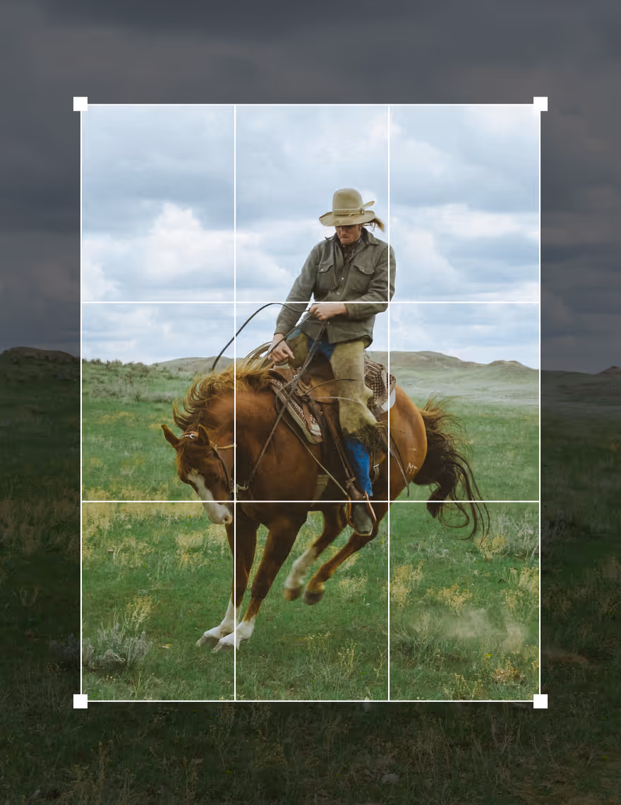 Crop tool UI over a photo of a man riding a bucking horse