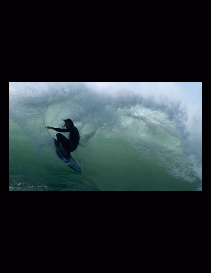 Video cropped into 16:9 of a surfer in a wave