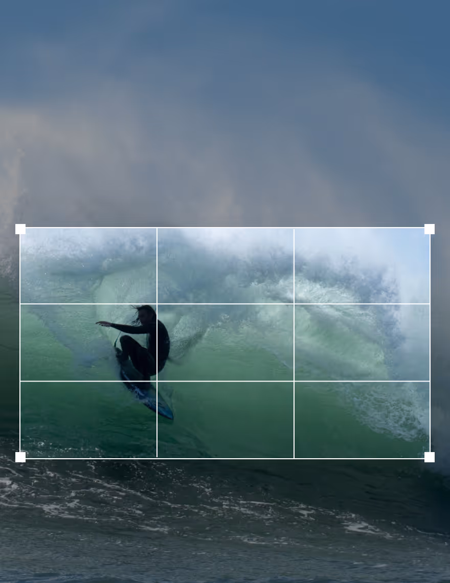 Video cropper UI 16:9 aspect ratio over a video still of a surfer in a wave