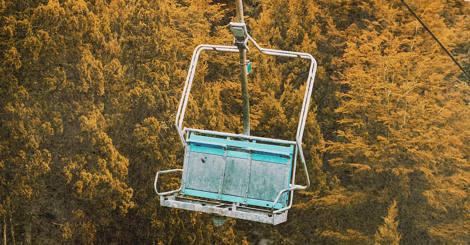 Distress texture effect on old ski lift in summer