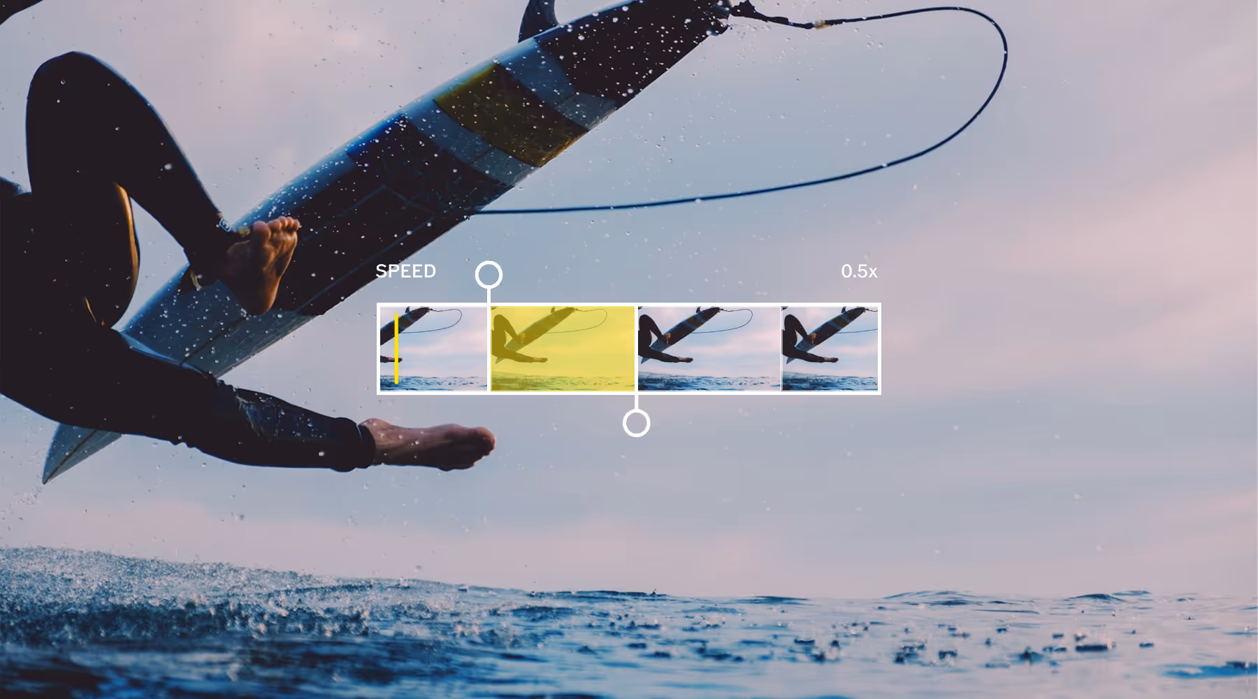Close-up of a person falling off a surfboard into the ocean with a video speed control overlay set to 0.5x.