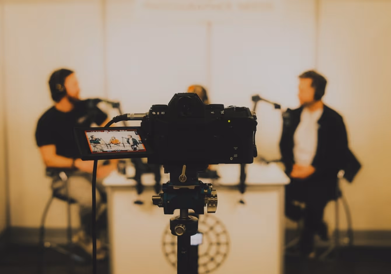 Photographer using camera and studio management software