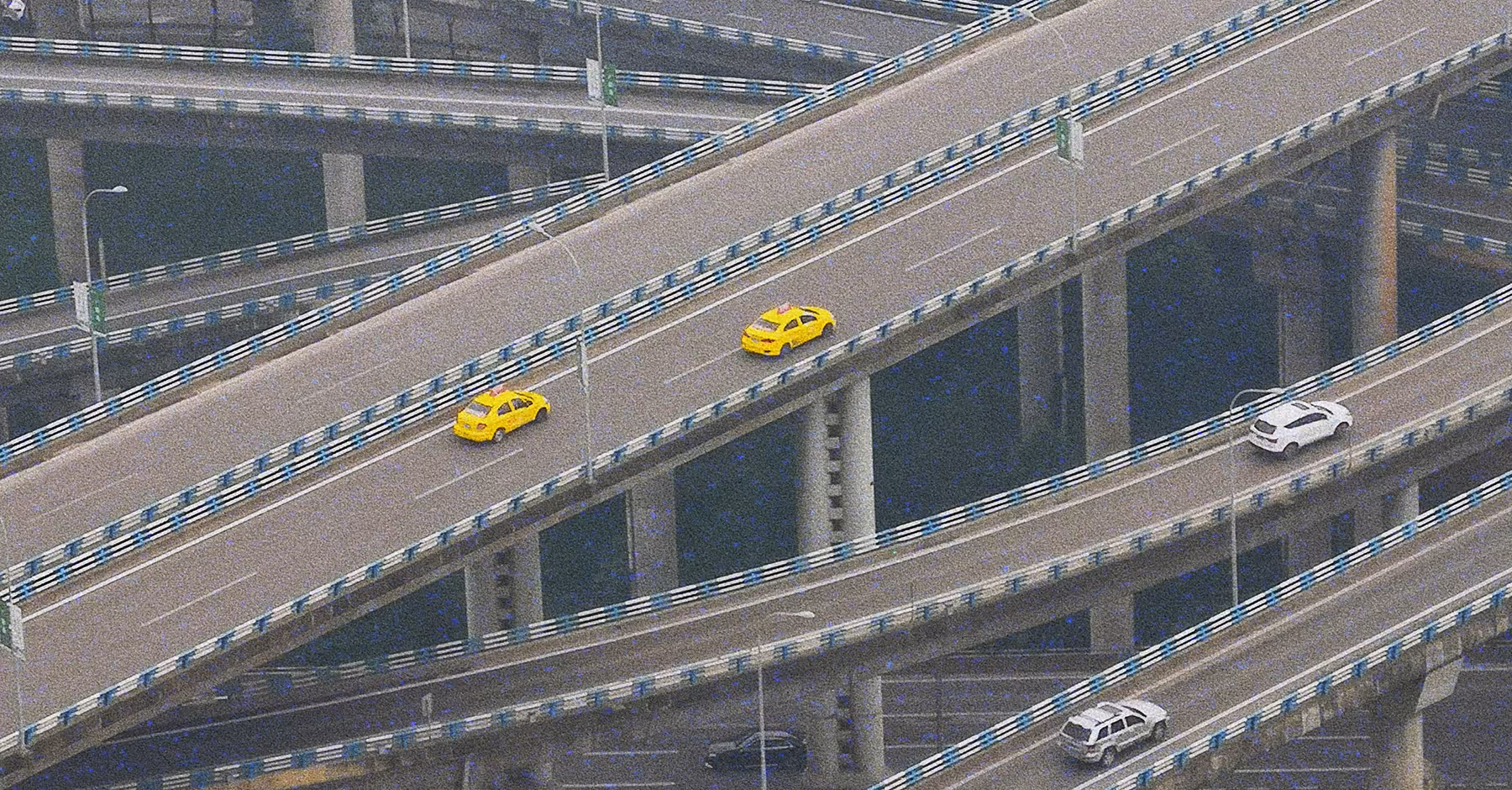 80s retro photo of an aerial view of multiple elevated highways with yellow and white cars driving on them, showing complex multilayer road structures.