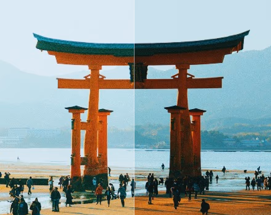 Crowded red torii gate on sandy shore with mountains and water in background, split by image exposure adjustment.