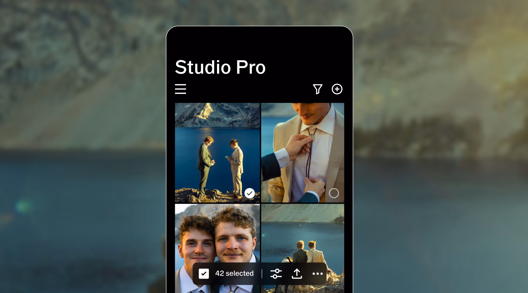 Mobile app screen titled Studio Pro showing photo grid of two men in suits near a lake and mountains.