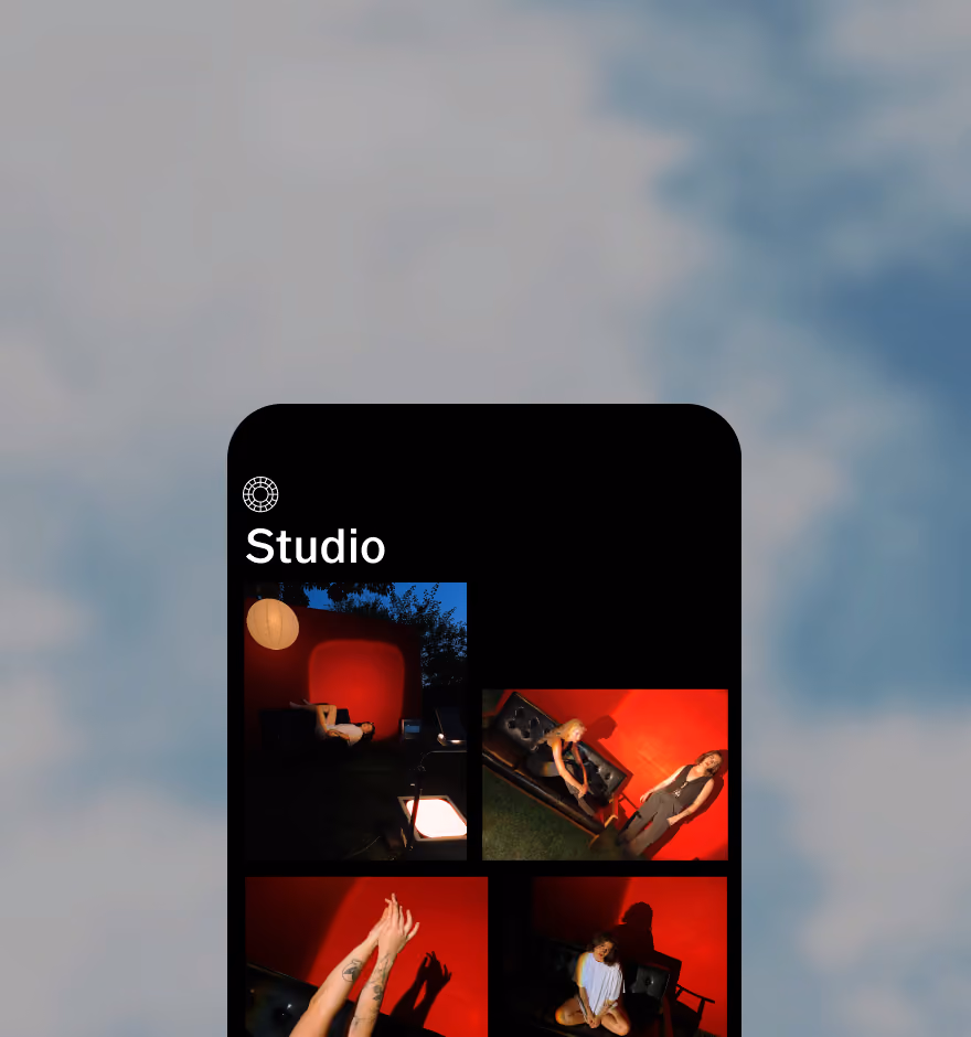 Mobile screen showing a photo app with four photos of people in a red-walled studio setting.