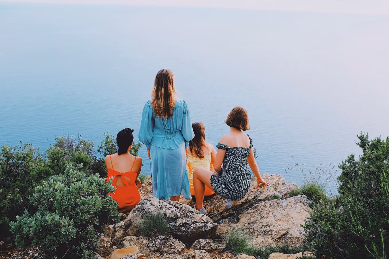 Four people on a clifftop above the sea, A8 PRO preset applied