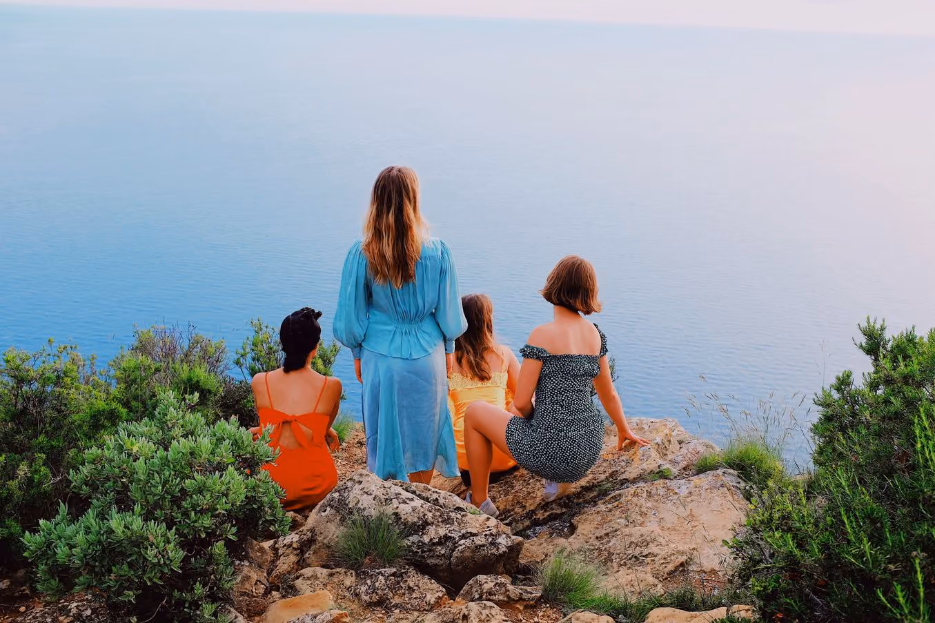 Four people on a clifftop above the sea, SS1 PRO preset applied