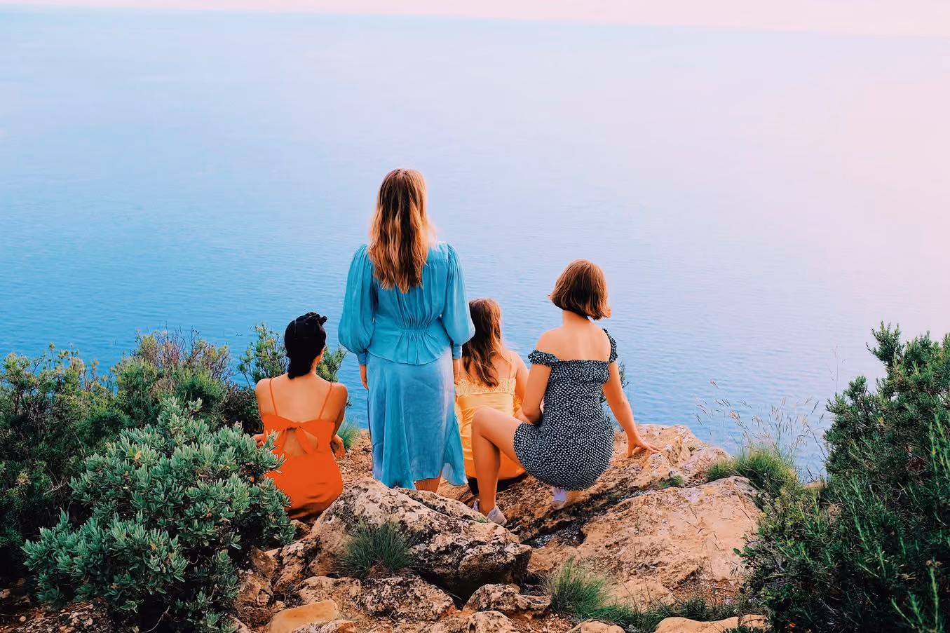 Four people on a clifftop above the sea, G6 PRO preset applied