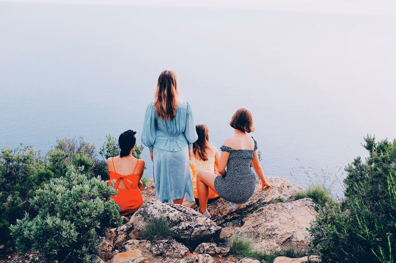 Four people on a clifftop above the sea, HB1 PRO preset applied