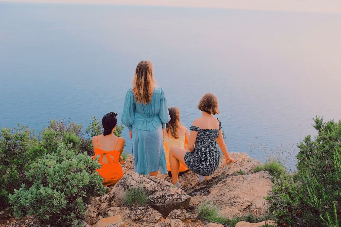 Four people on a clifftop above the sea, V3 PRO preset applied