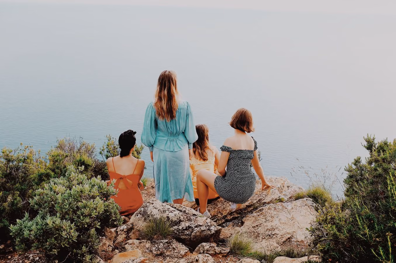 Four people on a clifftop above the sea, M5 PRO preset applied