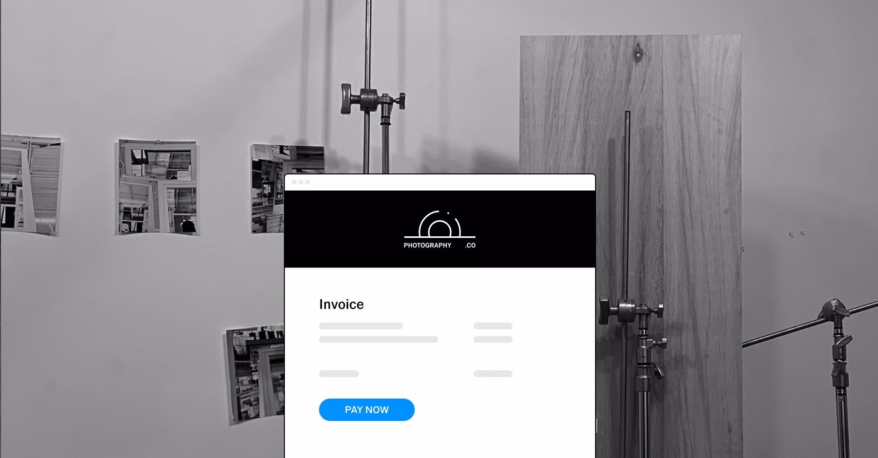 Studio wall with prints and light stands behind a branded invoice with a Pay Now button.