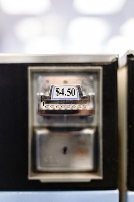 Zoomed-in view of a $4.50 price label on a vending machine, indoor setting.